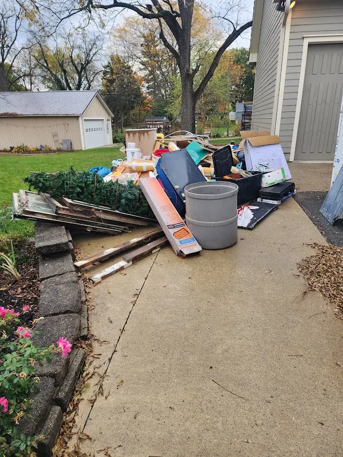 Dumpster being loaded with debris for 10 Yard Dumpster Rental in Syracuse